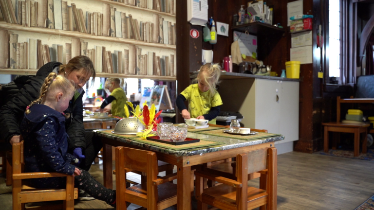 two kids in a dining table